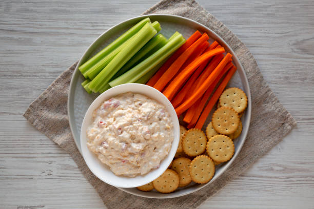 istock Homemade Pimento Cheese Dip with carrots, celery and crackers, top view. Flat lay, overhead, from above. 1201817951