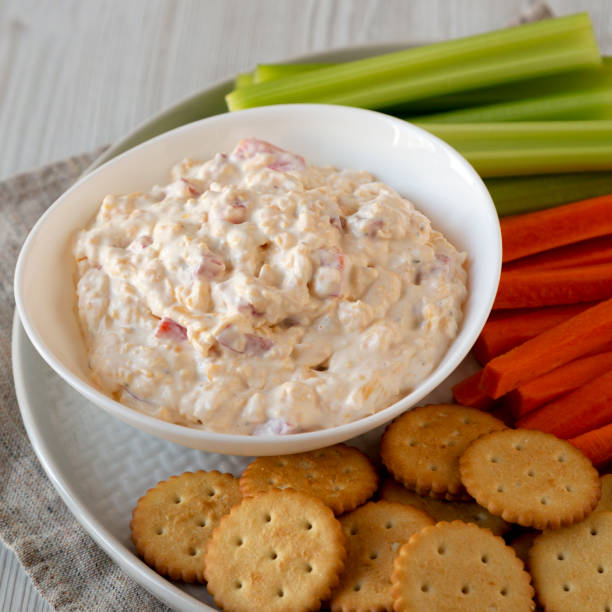 istock Homemade Pimento Cheese Dip with carrots, celery and crackers, low angle view. Close-up. 1201818753