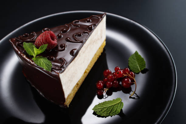 istock Chocolate cake with decoration and fruits as background 1201820119