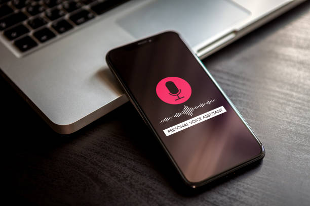 istock Personal assistant concept and voice recognition audio technology. Red button with microphone icon and sound imitation waves. 1201822880