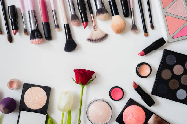 istock Make up concept: Professional makeup tools and accessories. Lipstick, mascara, nail polish, eyeshadow, powder, eyelash and foundation. Top view. 1201827574