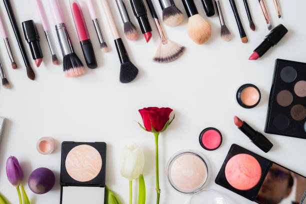 istock Make up concept: Professional makeup tools and accessories. Lipstick, mascara, nail polish, eyeshadow, powder, eyelash and foundation. Top view. 1201828098