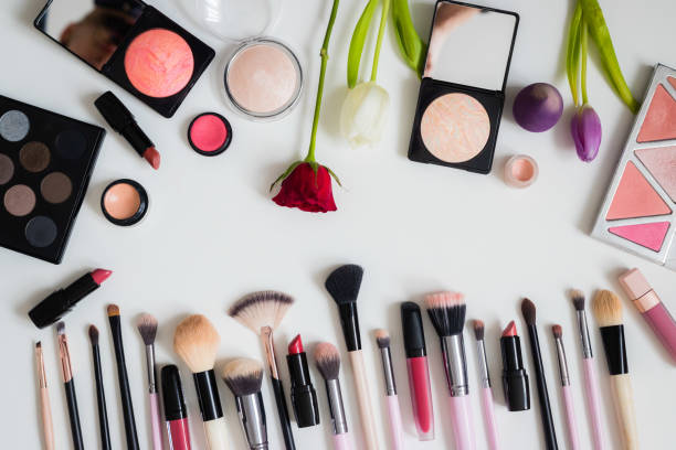 istock Make up concept: Professional makeup tools and accessories. Lipstick, mascara, nail polish, eyeshadow, powder, eyelash and foundation. Top view. 1201828108