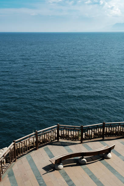 istock Blue bench by the sea. Copy space. 1201828177