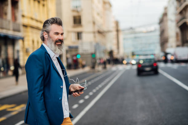 istock Businessman using a smartphone on the street 1201828251