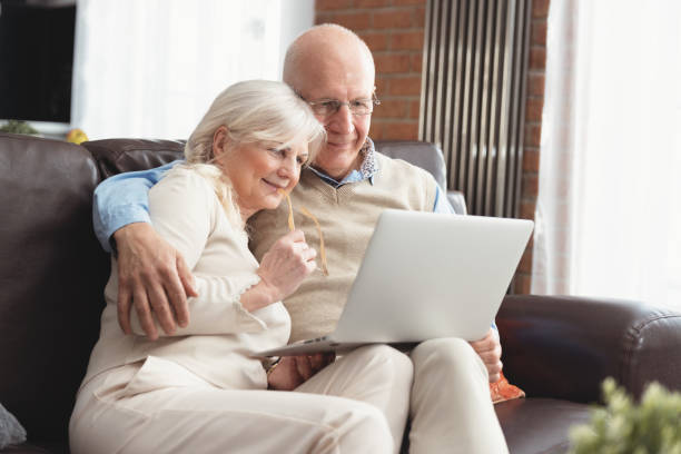 istock Senior couple browsing the internet together 1201828520