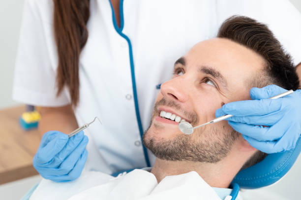 istock Man having teeth examined at dentists 1201828649
