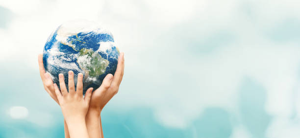 istock Earth globe in family hands. World environment day 1201829362