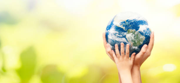istock Earth globe in family hands. World environment day 1201829371