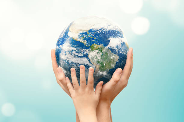 istock Earth globe in family hands. World environment day 1201829375