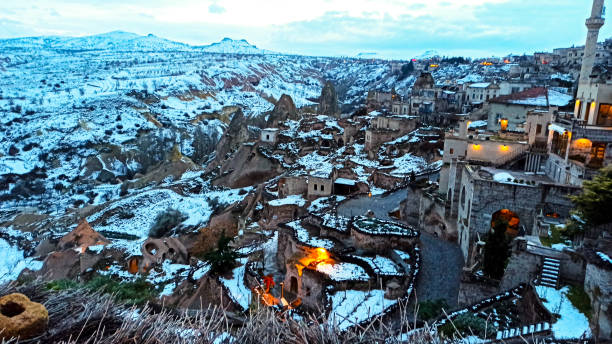istock Fairy Chimneys covered with snow near Uchisar, cave castle, Cappadocia, Turkey 1201831724