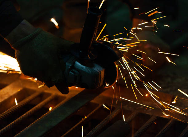 istock Working with a cutting machine in a dark room 1201832786