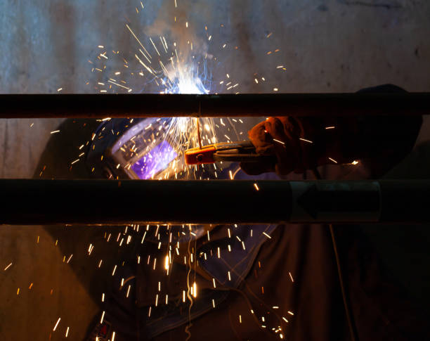 istock Electric welding works in a dark room 1201832842