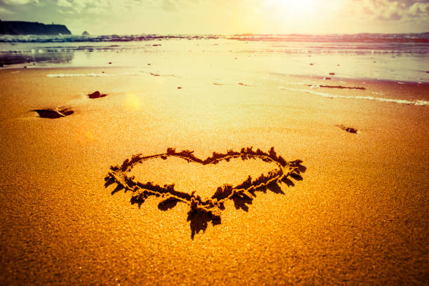 istock Heart of sand on the beach 1201833417