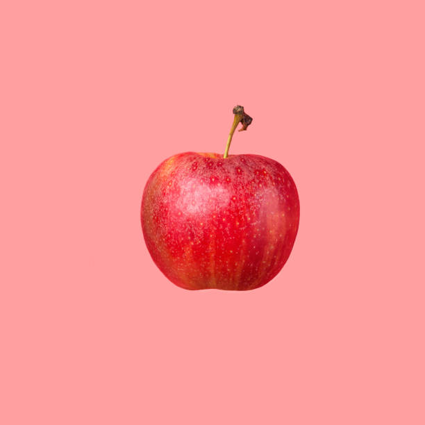 istock Floating levitating ripe red apple on cherry pink background. Creative food poster 1201835648