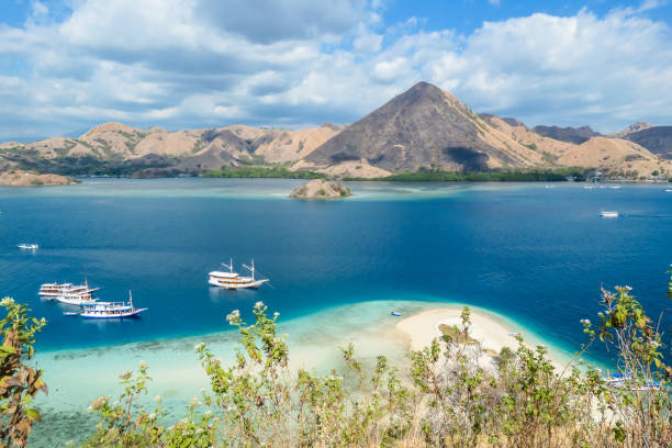 istock Komodo - A panoramic view on the white sand beach and surrounding islands 1201835707
