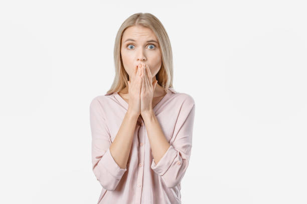 istock Young beautiful woman standing over isolated white background afraid and shocked 1201837074