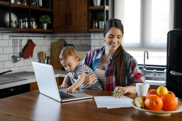 istock Young mother juggling work and child care 1201838279