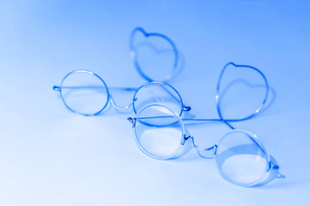 istock Old fashion glasses on blue background 1201839622