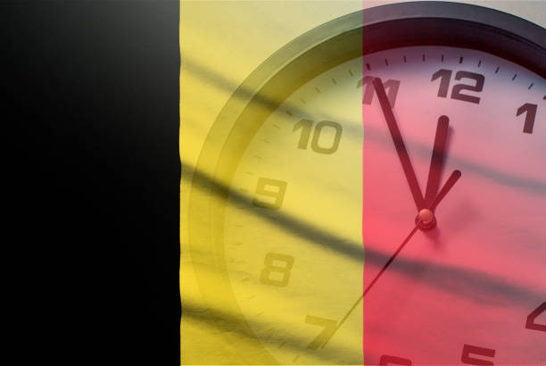 istock Belgium flag with dial of a clock 1201840441