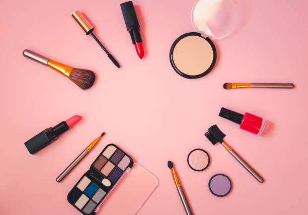 istock Frame made of makeup cosmetics and brushes on pink background. 1201841729