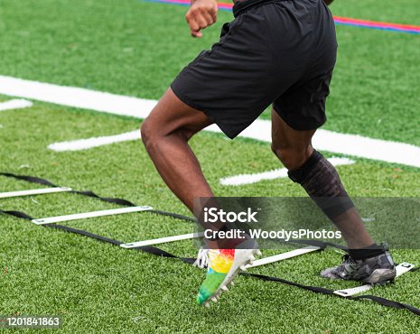 istock Athlete performing ladder drills on sports field 1201841863