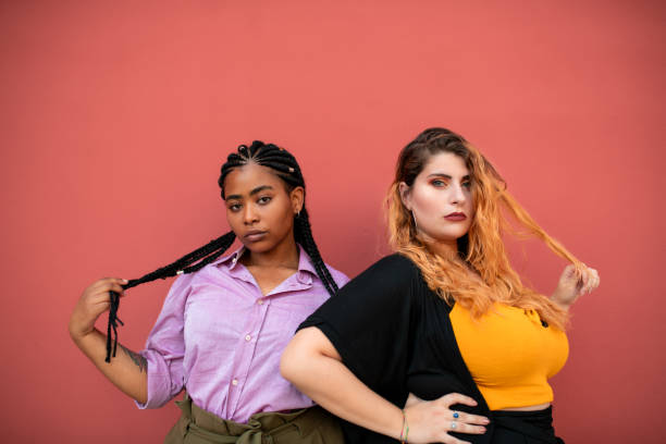 istock Cool millennial girls looking at the camera. 1201847836