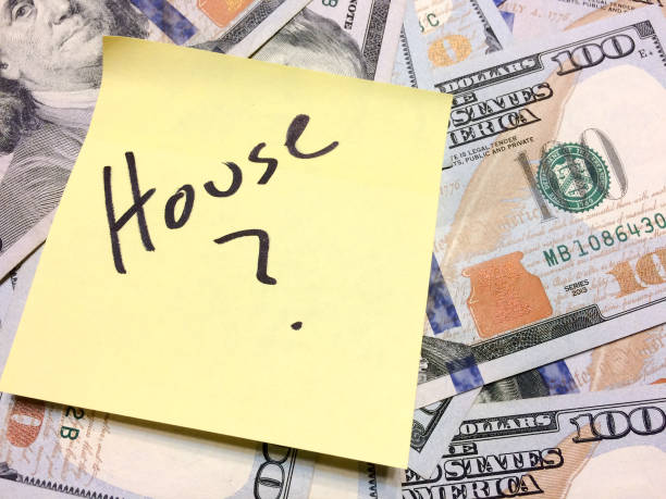 American cash money and yellow sticky note with text House with question mark American cash money and yellow sticky note with text House with question mark in black color aerial view philadelphia federal reserve stock pictures, royalty-free photos & images