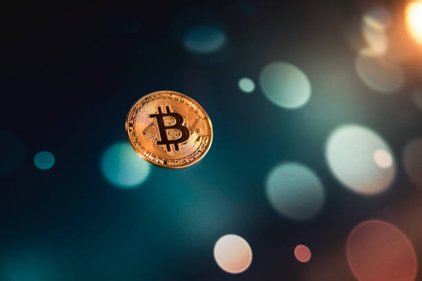 bitcoin on a led technological bokeh light - iron mining photos et images de collection