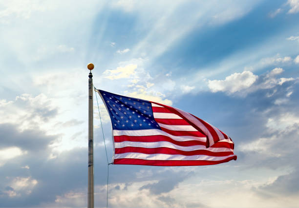 istock American Flag with Sun Breaking Out 1201849091