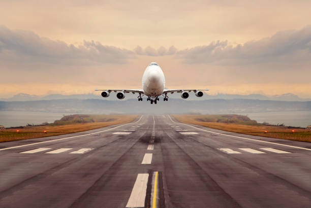 A large cargo airplane taking off. A large cargo airplane taking off. airplane landing stock pictures, royalty-free photos & images