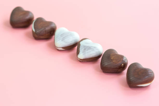 istock chocolate heart shape Valentine's day on pink background for texture 1201850291