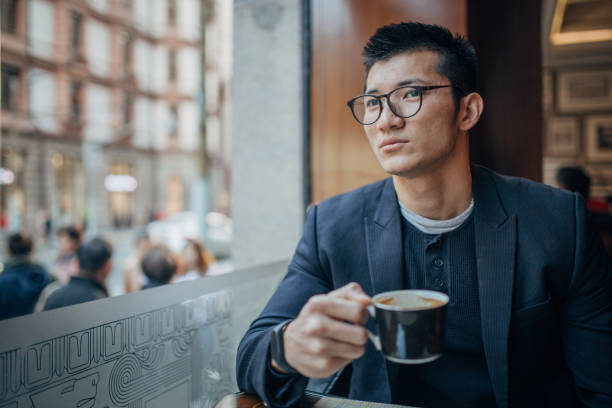 istock Young businessman is having coffee 1201851639