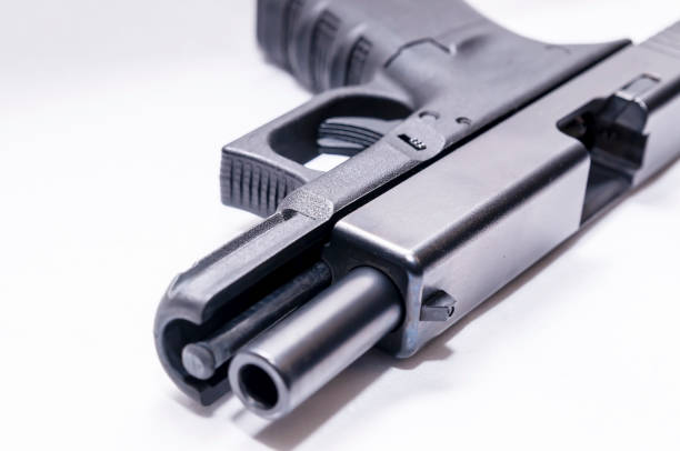 istock A black 9mm semi automatic pistol with an opened slide 1201851669