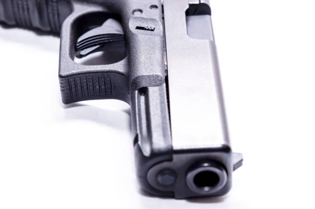 istock The muzzle of a black 9mm semi automatic pistol 1201851695