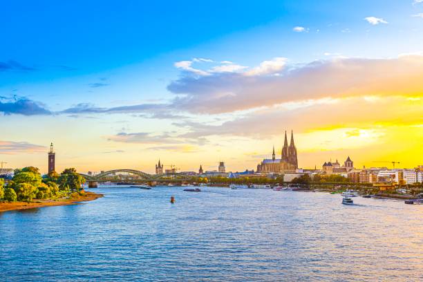 sunset in cologne with Dome and river Rhine spectacular sunset in cologne with Dome and river Rhine cologne stock pictures, royalty-free photos & images