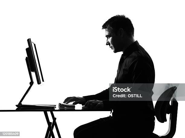 Silhouette Side View Man Computing Computer Serious Stock Photo - Download Image Now