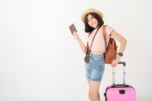 Beautiful young asian tourist woman happy on white background studio