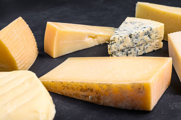 istock Different types of delicious cheese. Black background. Top view 1201862507
