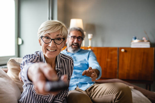 istock Senior couple watching TV 1201863654