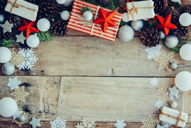 istock Christmas background with gift boxes and decorations on the wood 1201865388