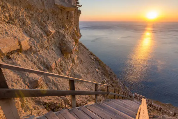 Mountain landscape, stairs descending to the sea