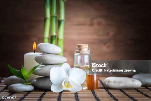 White Zen Balance Stonesorchid And Bamboo Plant On The Wooden Table Stock Photo - Download Image Now