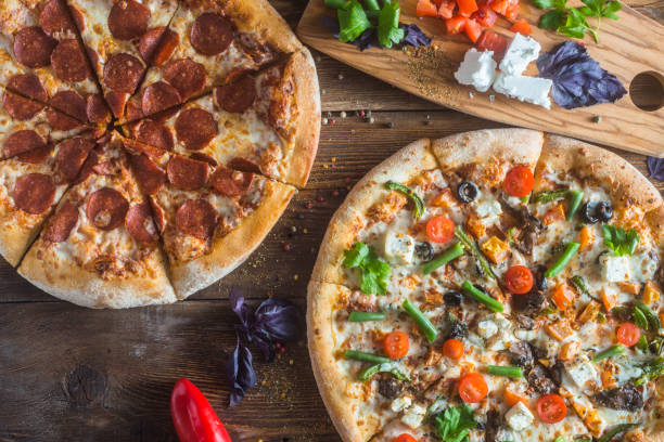 istock Pizza with cheese, pepperoni, chicken and pepper, a slice for a gourmet dinner 1201871691