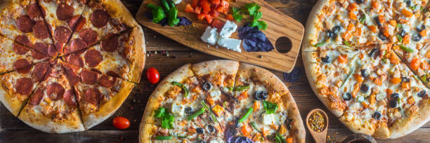istock Pizza with cheese, pepperoni, chicken and pepper, a slice for a gourmet dinner 1201871732