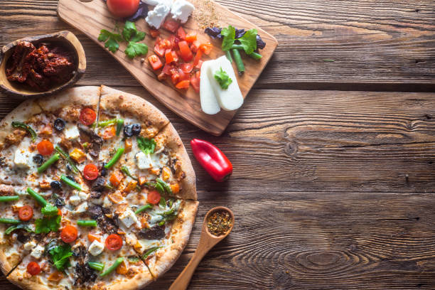 Pizza with cheese, pepperoni, chicken and pepper, a slice for a gourmet dinner
