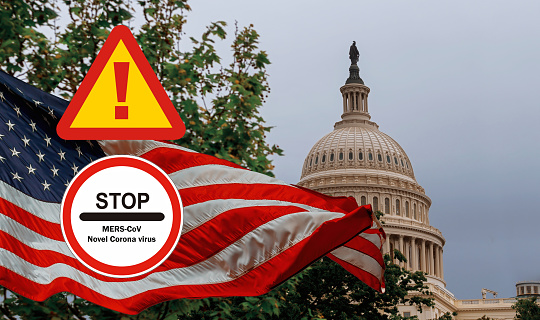 Middle East Respiratory Syndrome Coronavirus chinese infection US Capitol building with a waving American flag superimposed on the sky Capitol Hill in Washington DC