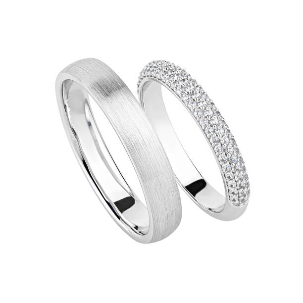 istock Pair of silver wedding rings isolated on white background 1201875043