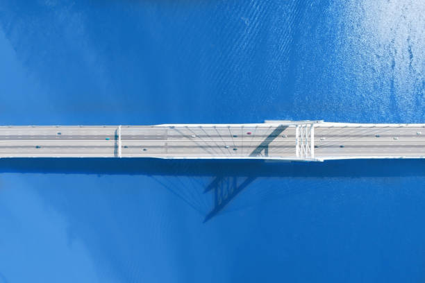 istock Bridge over large river or sea aerial top view 1201875069