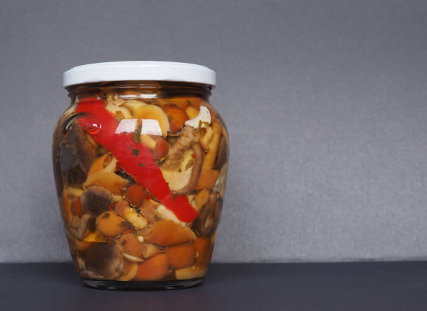 istock mixed champignons and porcini mushrooms in jar 1201875458